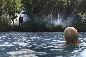Chelsea (Willa Ford) discovers Jason (Derek Mears) watching her from the shores of Crystal Lake in the 2009 remake of "Friday the 13th."